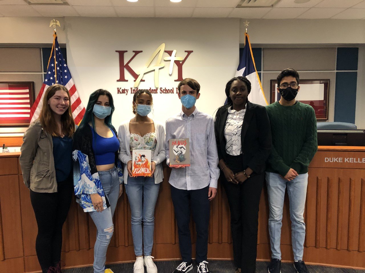 Katy ISD students, from left, Alison Franks, Sofa Dixon, Gabrielle Izu, Cameron Samuels, Peniel Otto and Jaagat Prashar have spoken against banning books and distributed such books to their fellow students. Izu is holding Flamer, a book that has been pulled from Katy ISD library shelves. Samuels is holding Maus, which the district is considering removing from the shelves. A district spokesperson said a decision on whether to pull Maus will come later in the week.